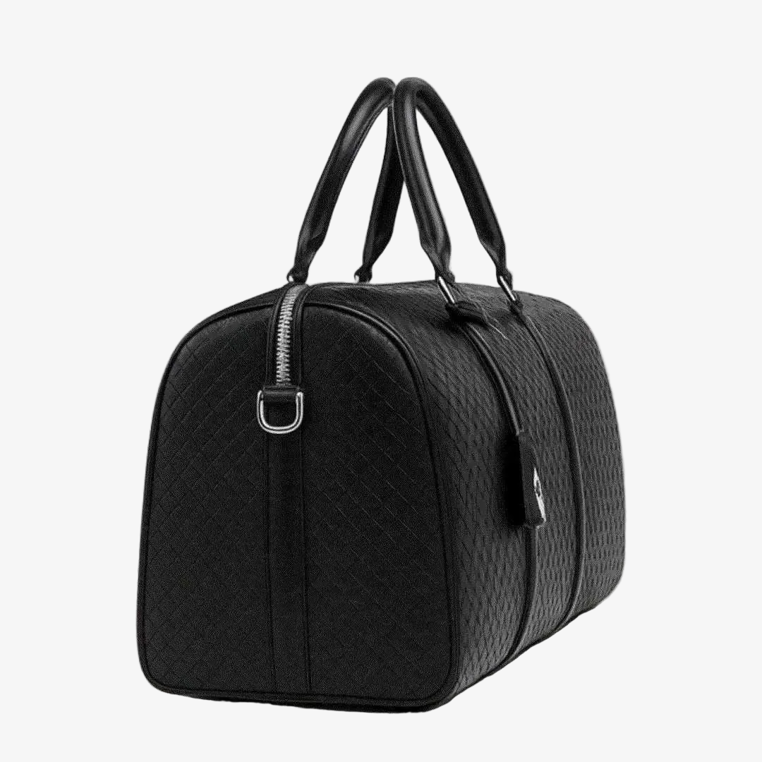 Black quilted duffel bag on a white background