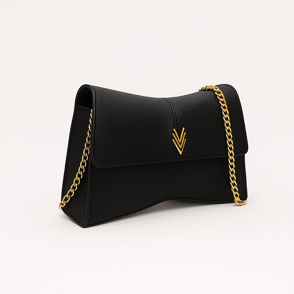 Black handbag with gold chain strap on a white background
