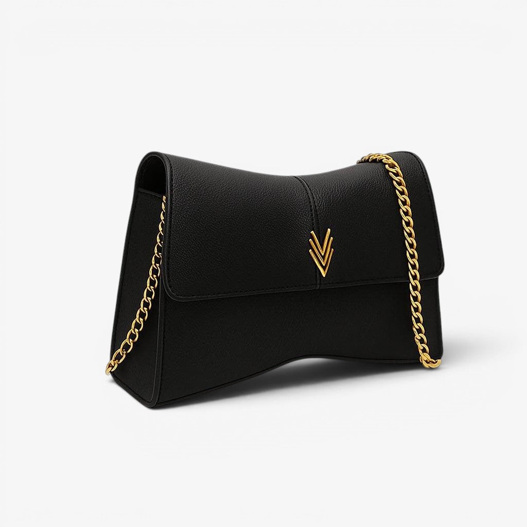 Black handbag with gold chain strap on a white background