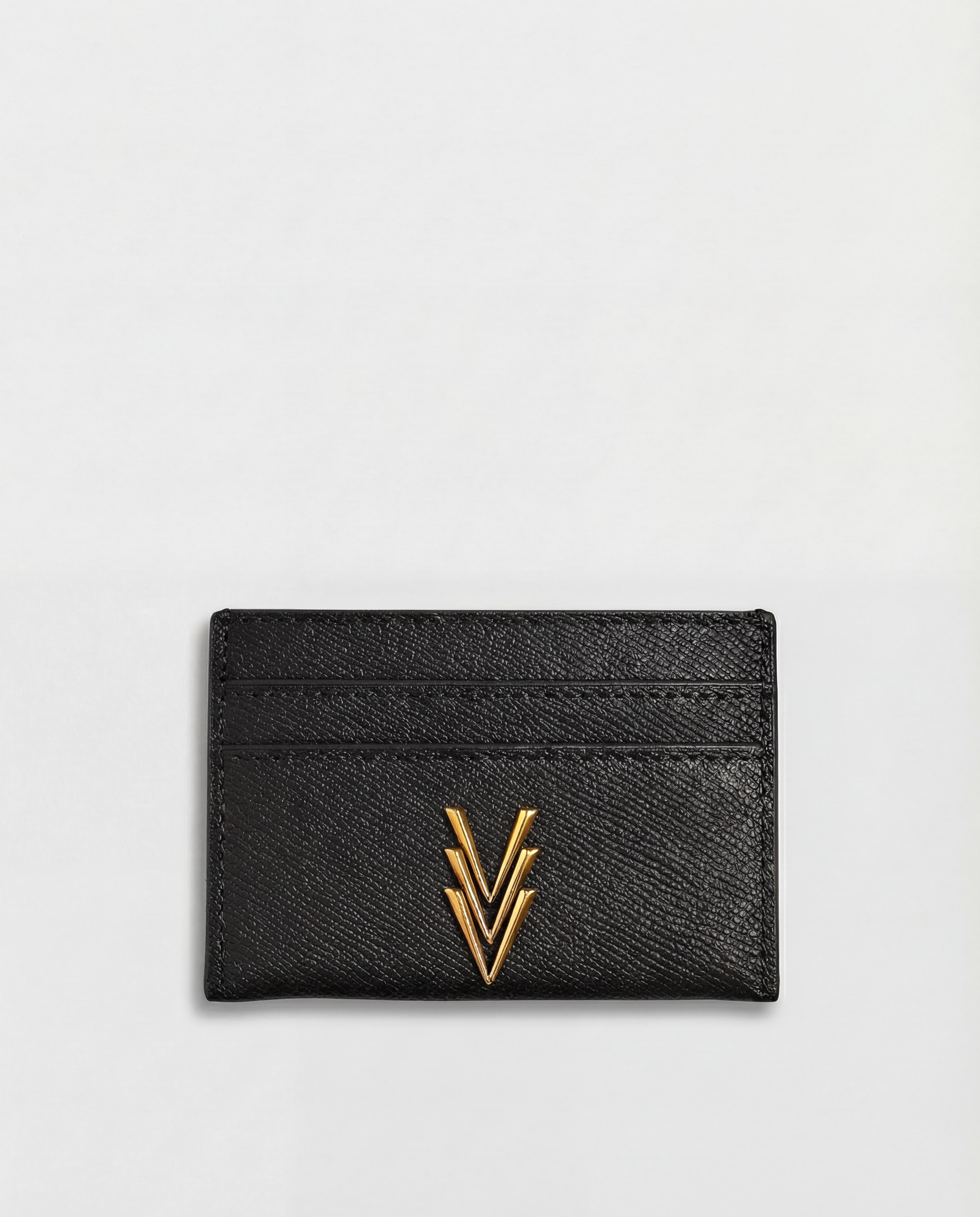 Black cardholder with gold emblem on a light gray background