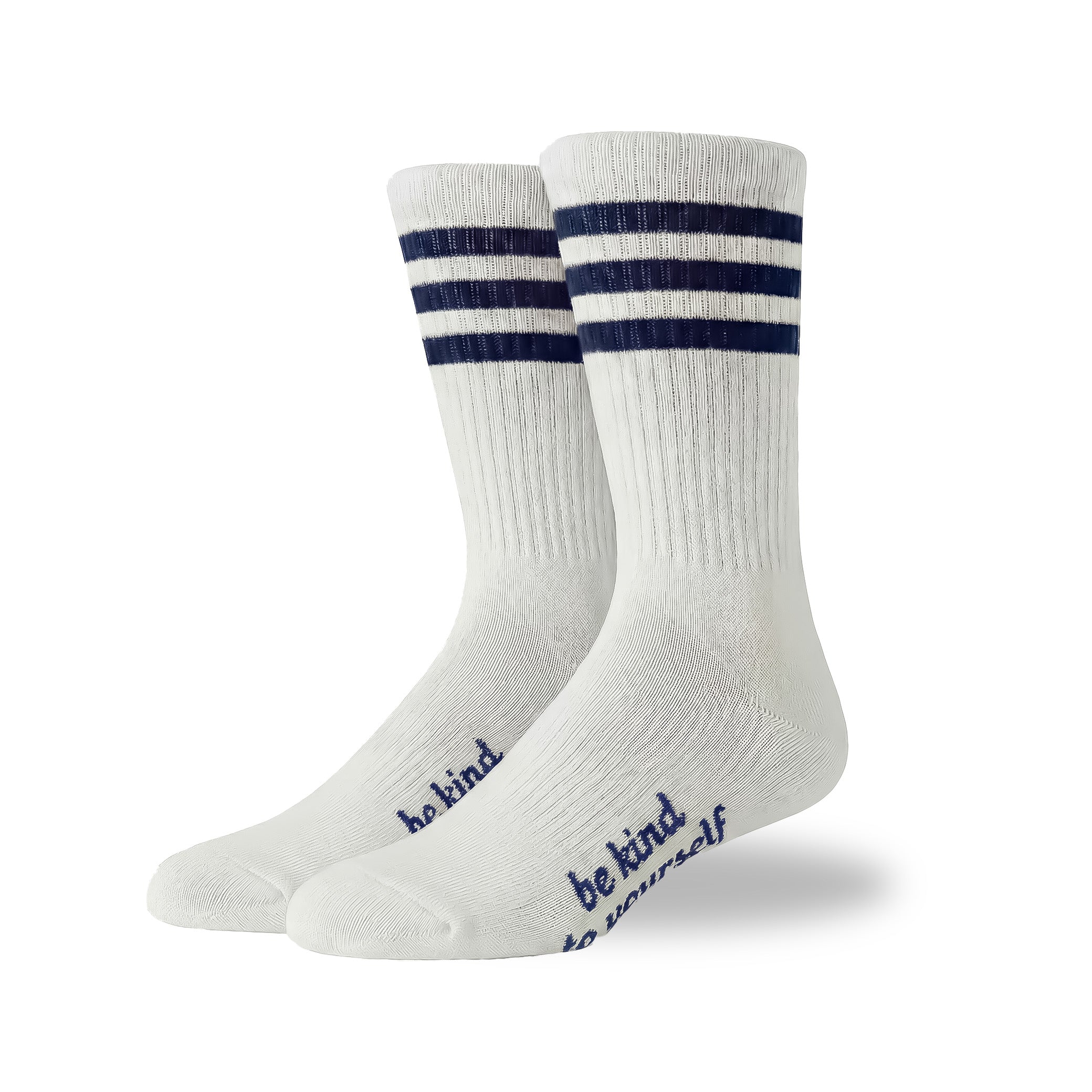 White socks with blue stripes and 'be kind' text on a white background