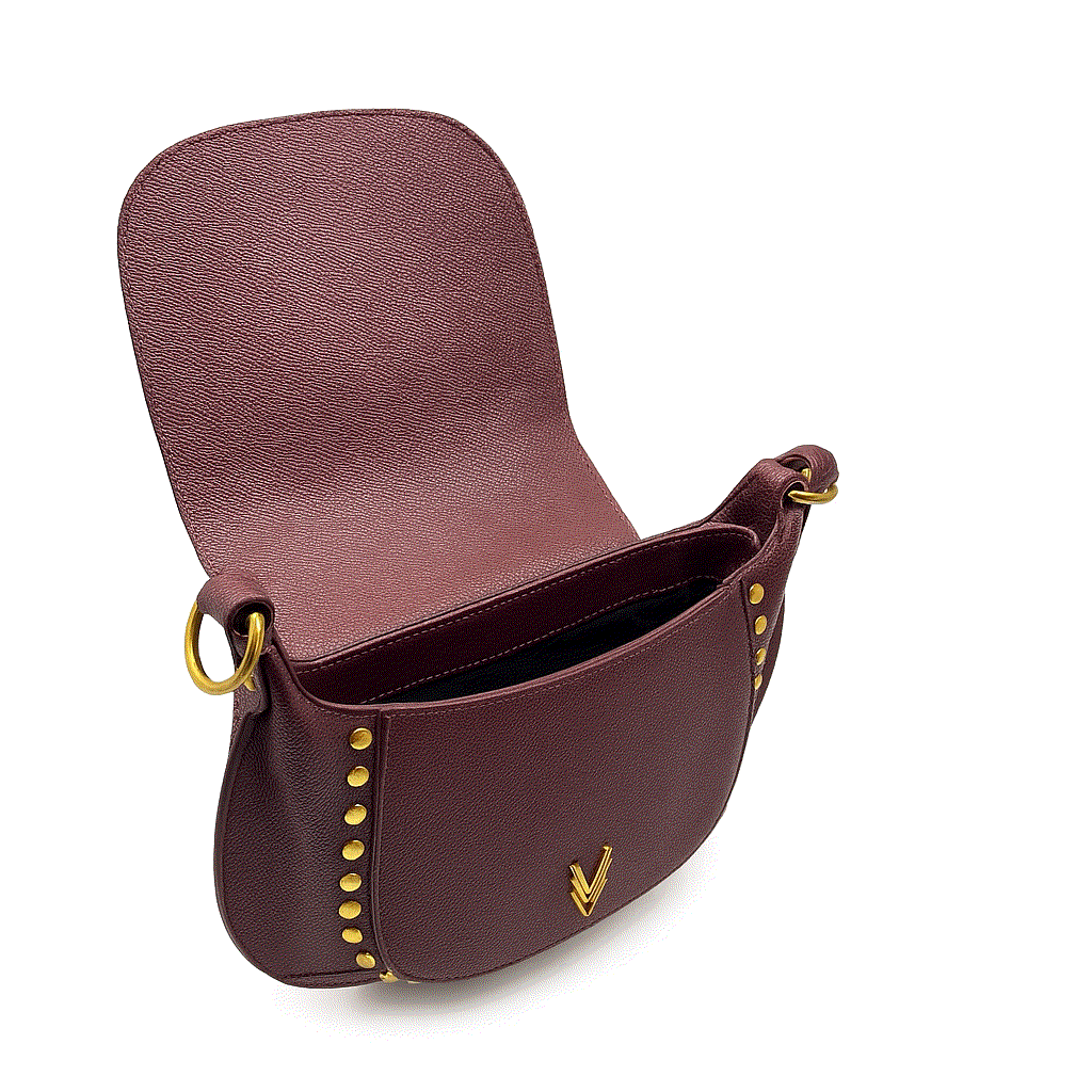 Brown leather handbag with gold accents on a white background