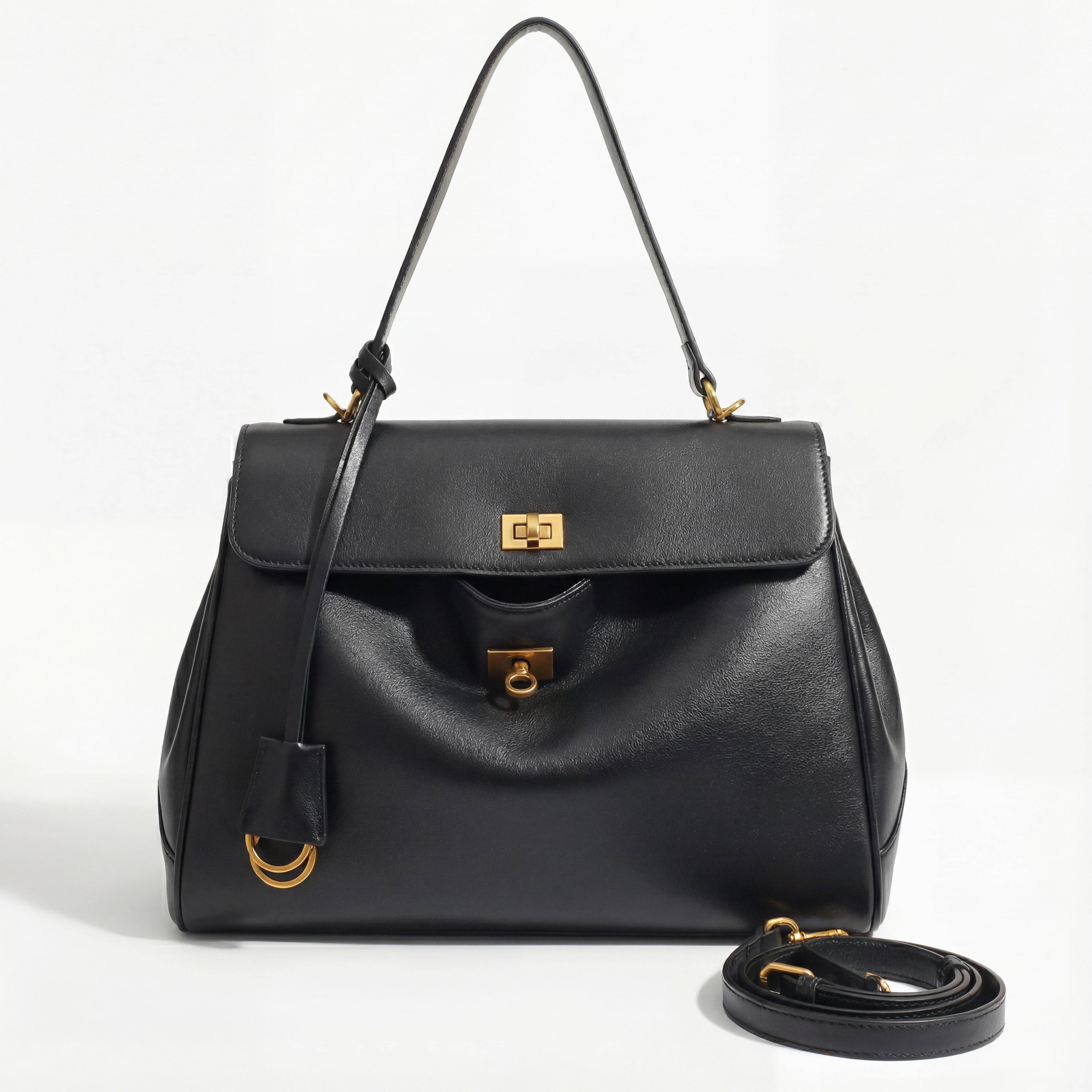 Black handbag with gold accents on a white background