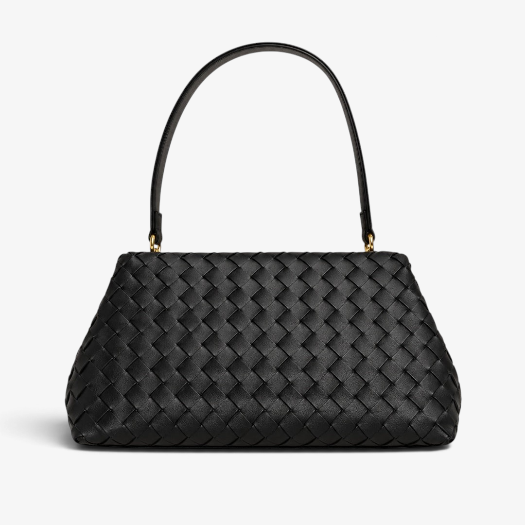 A black woven leather handbag with a structured, rounded rectangular body and a single top handle, shown against a plain white background.