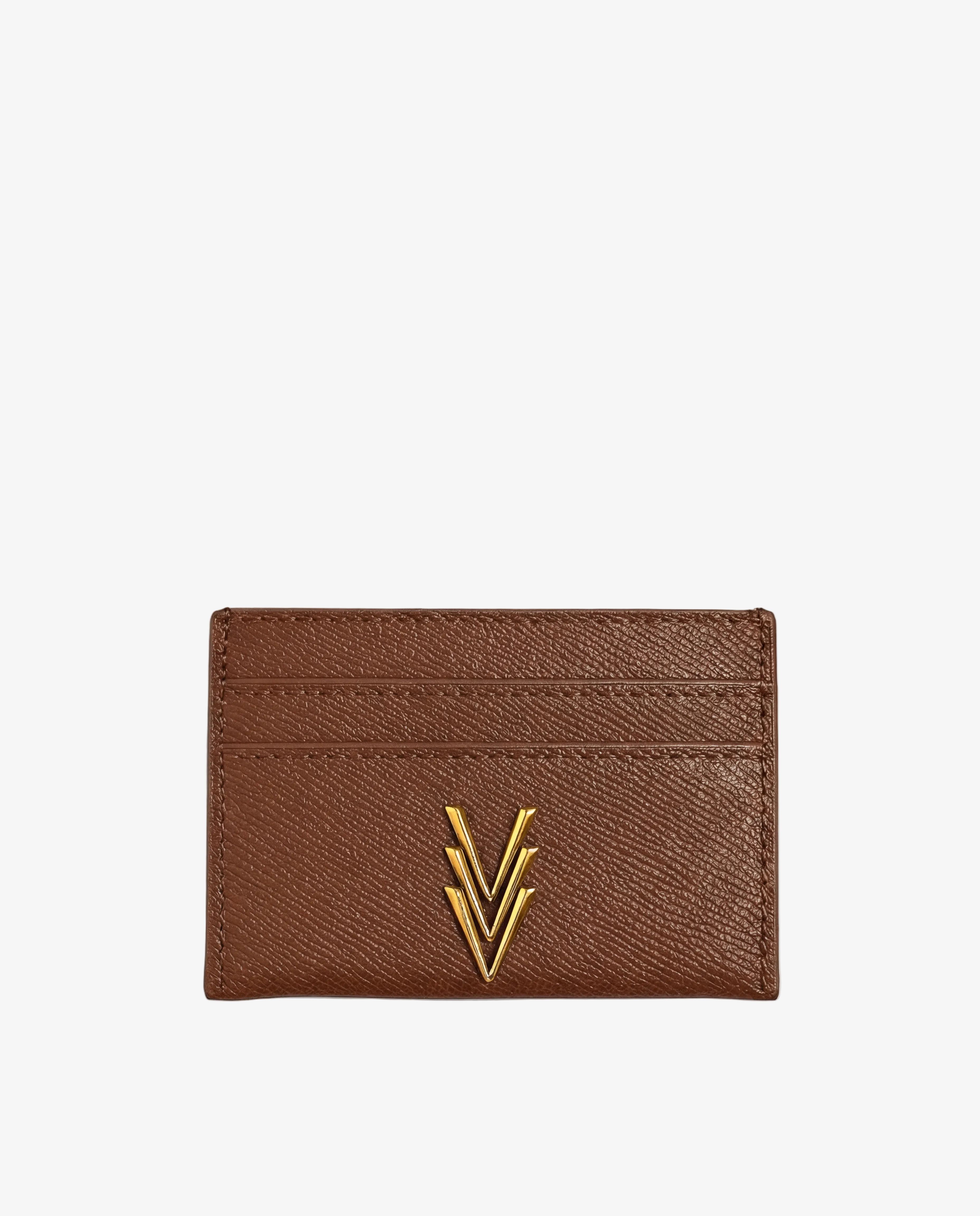 Brown leather cardholder with gold emblem on a light gray background