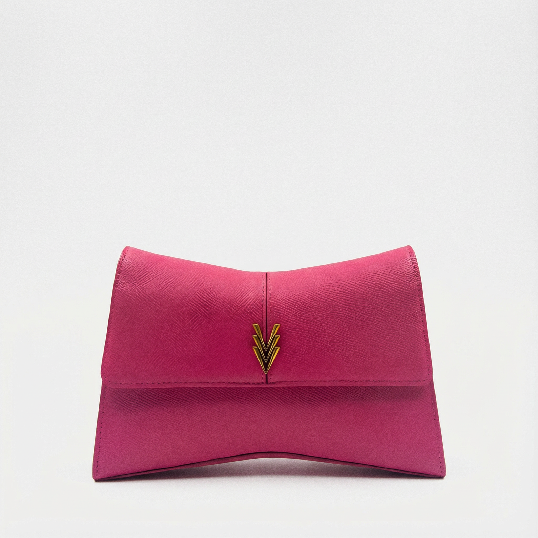 Pink clutch bag with a gold emblem on a light gray background