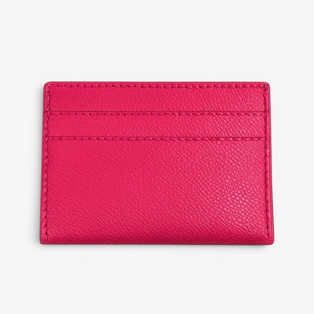 Pink leather cardholder on a white background