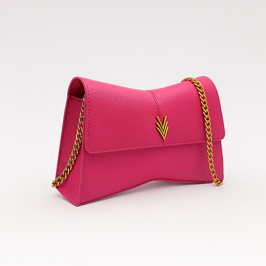Pink handbag with gold chain strap on a white background