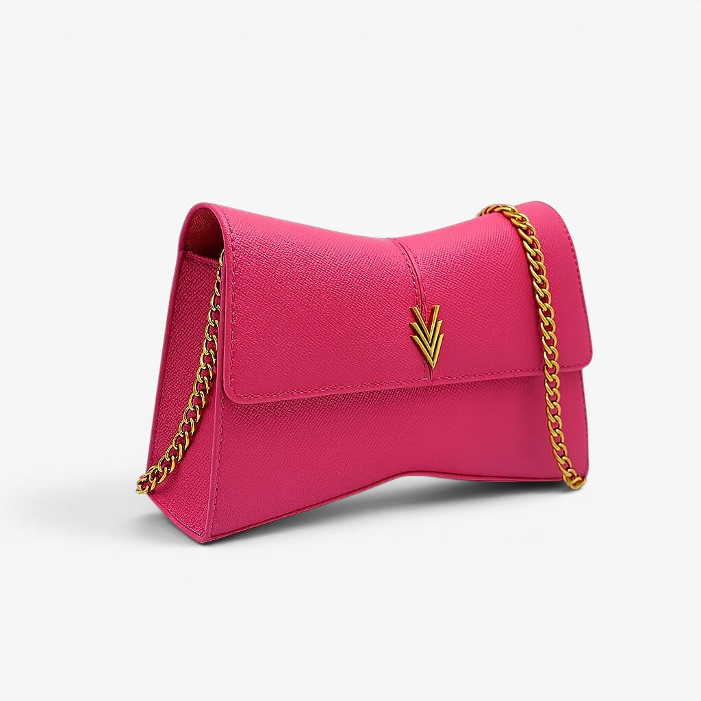Pink handbag with gold chain strap on a white background