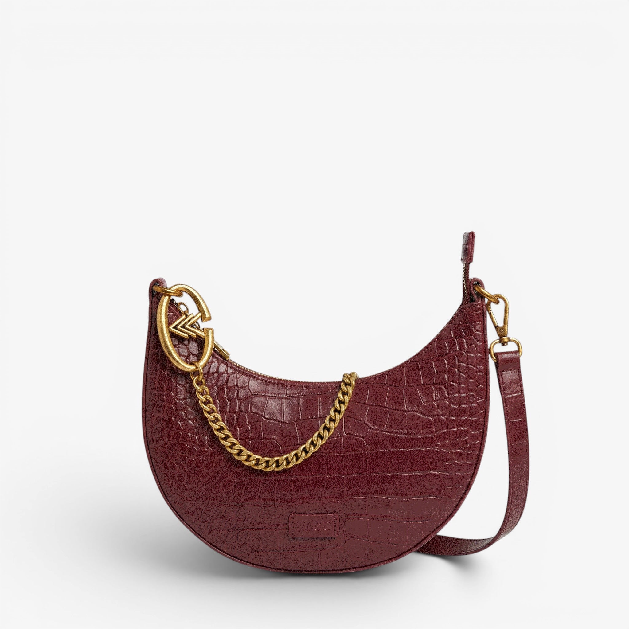 Maroon handbag with gold chain detail on a light gray background