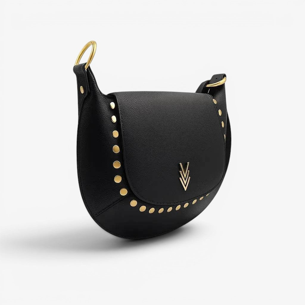 Black saddle bag with gold studs and a logo on a white background