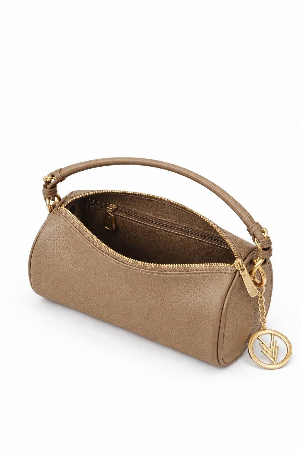 Beige handbag with a gold handle and keychain on a white background