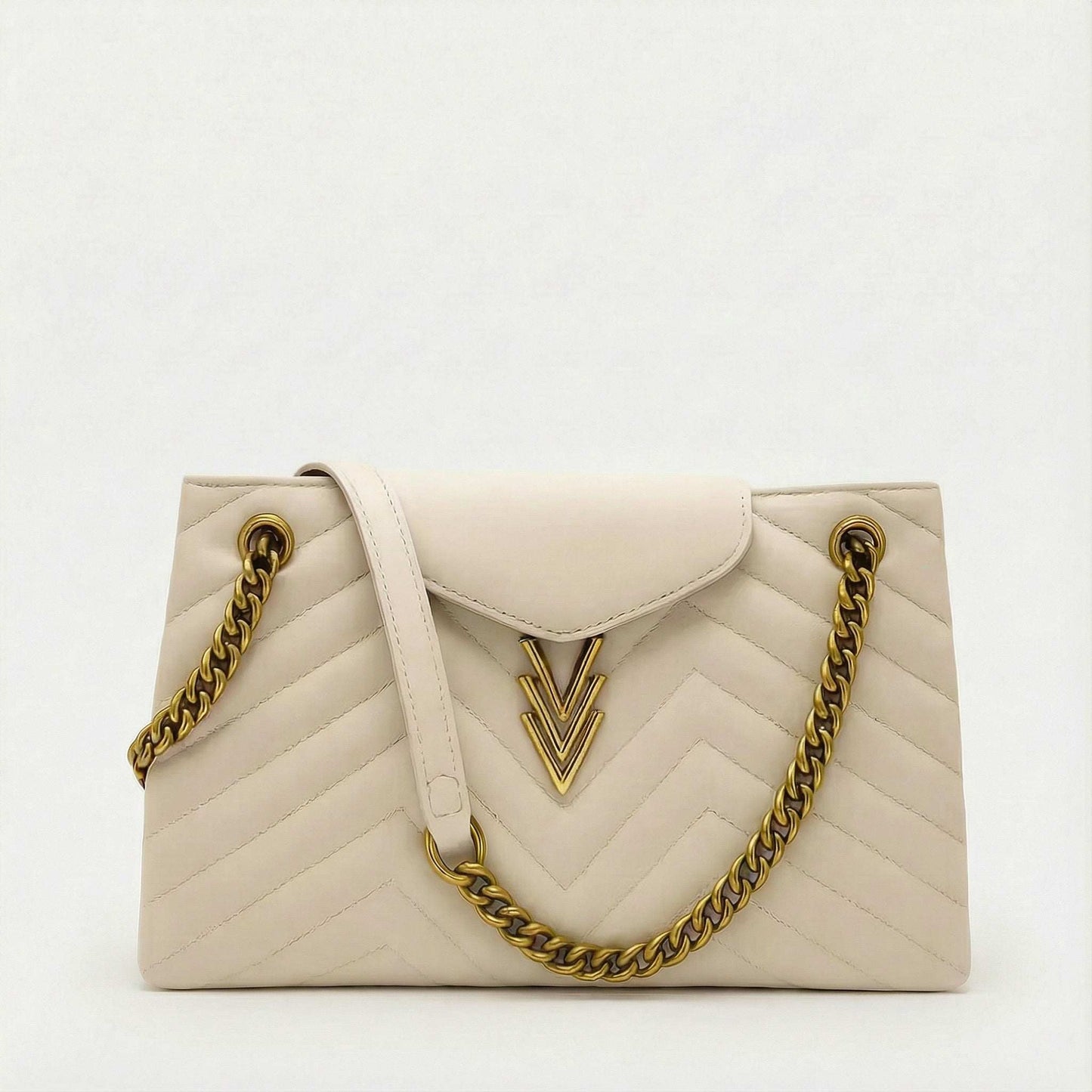 White handbag with gold chain strap on a white background