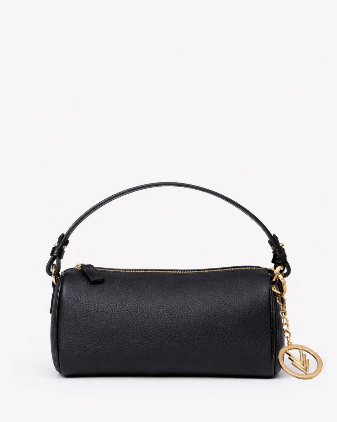 Black handbag with gold chain and clasp on a white background