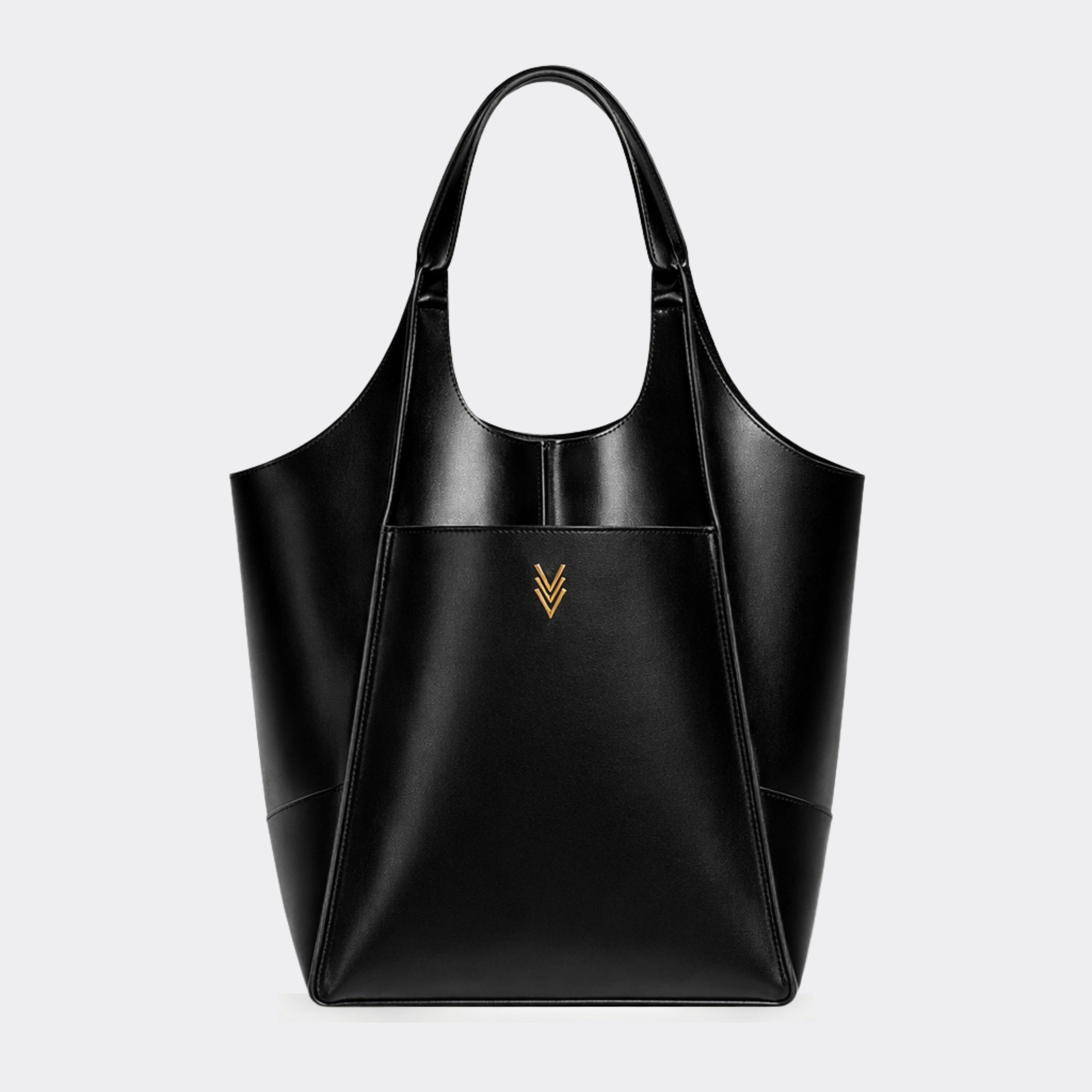 Black tote bag with a gold logo on a light gray background