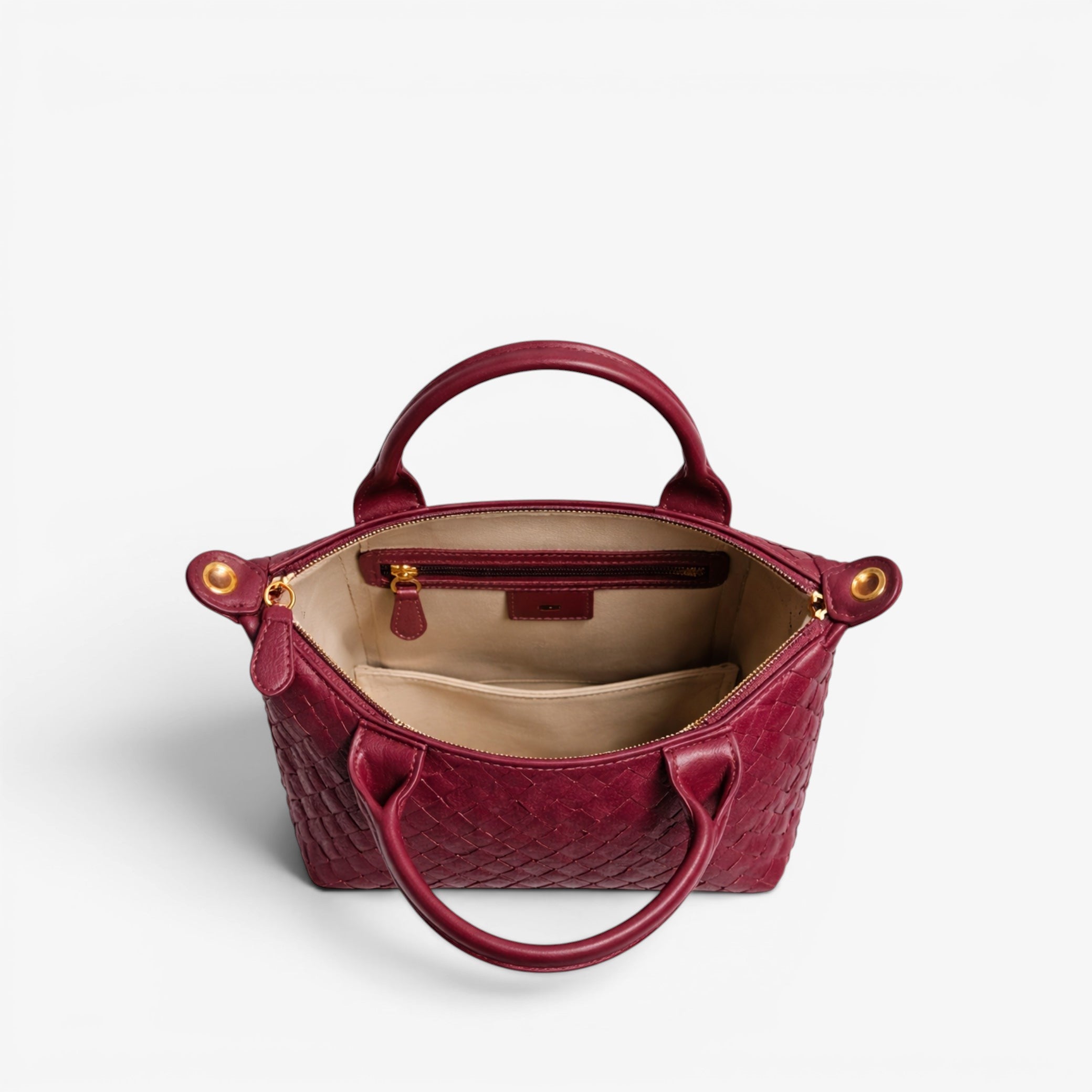 Red handbag with gold accents on a white background