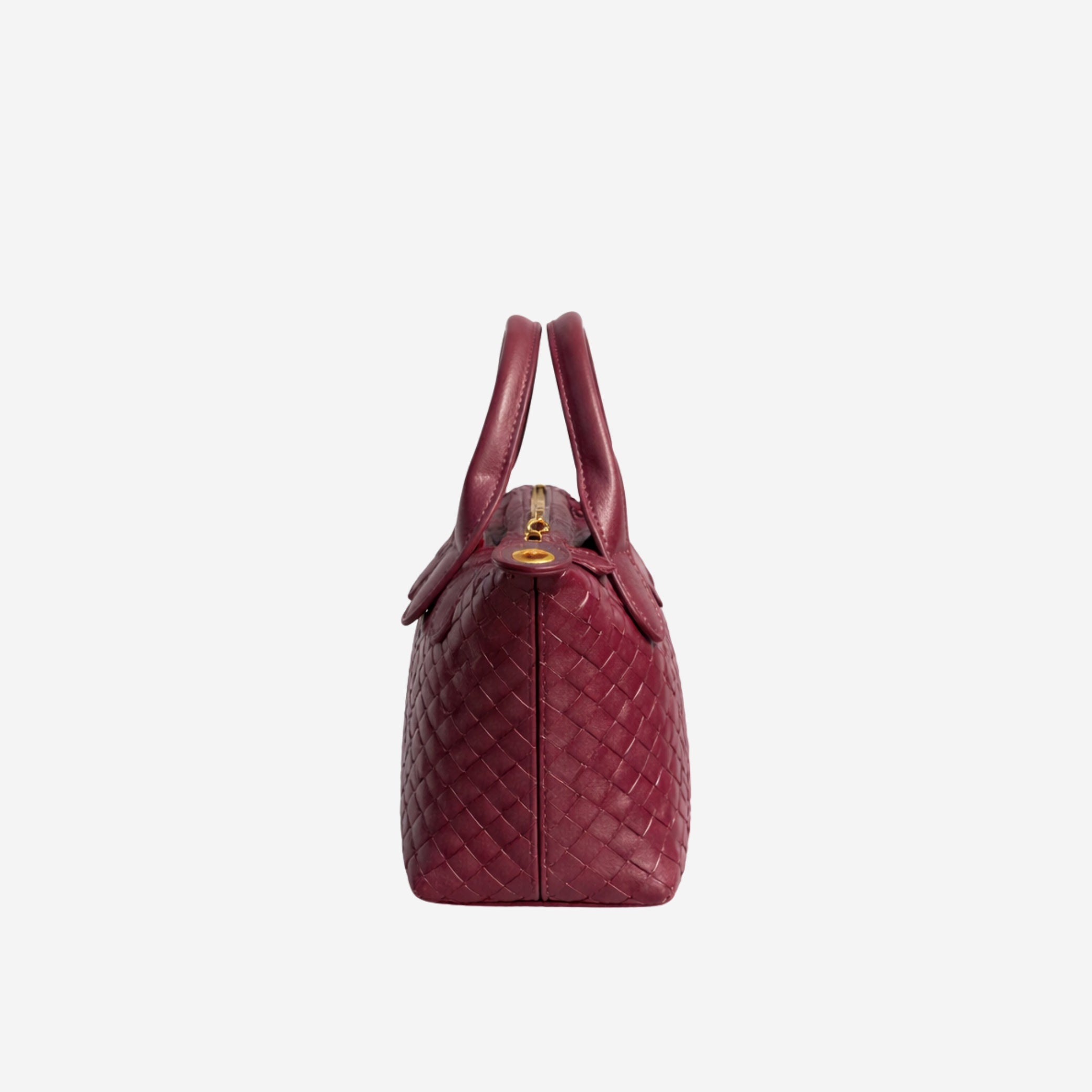 Red woven handbag on a white background