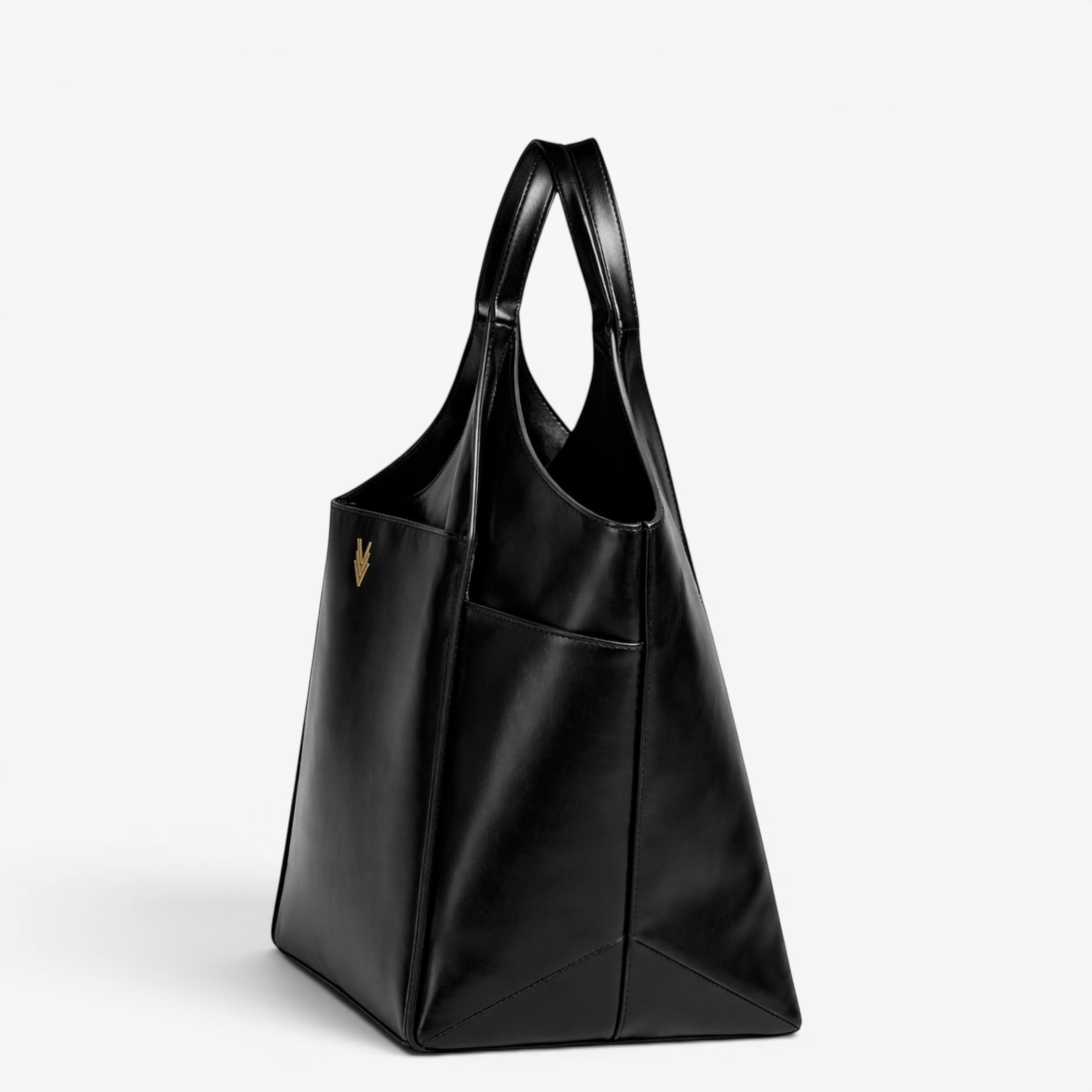 VAGOSHOPS black vegan leather oversized tote bag with gold logo and dual carry handles.