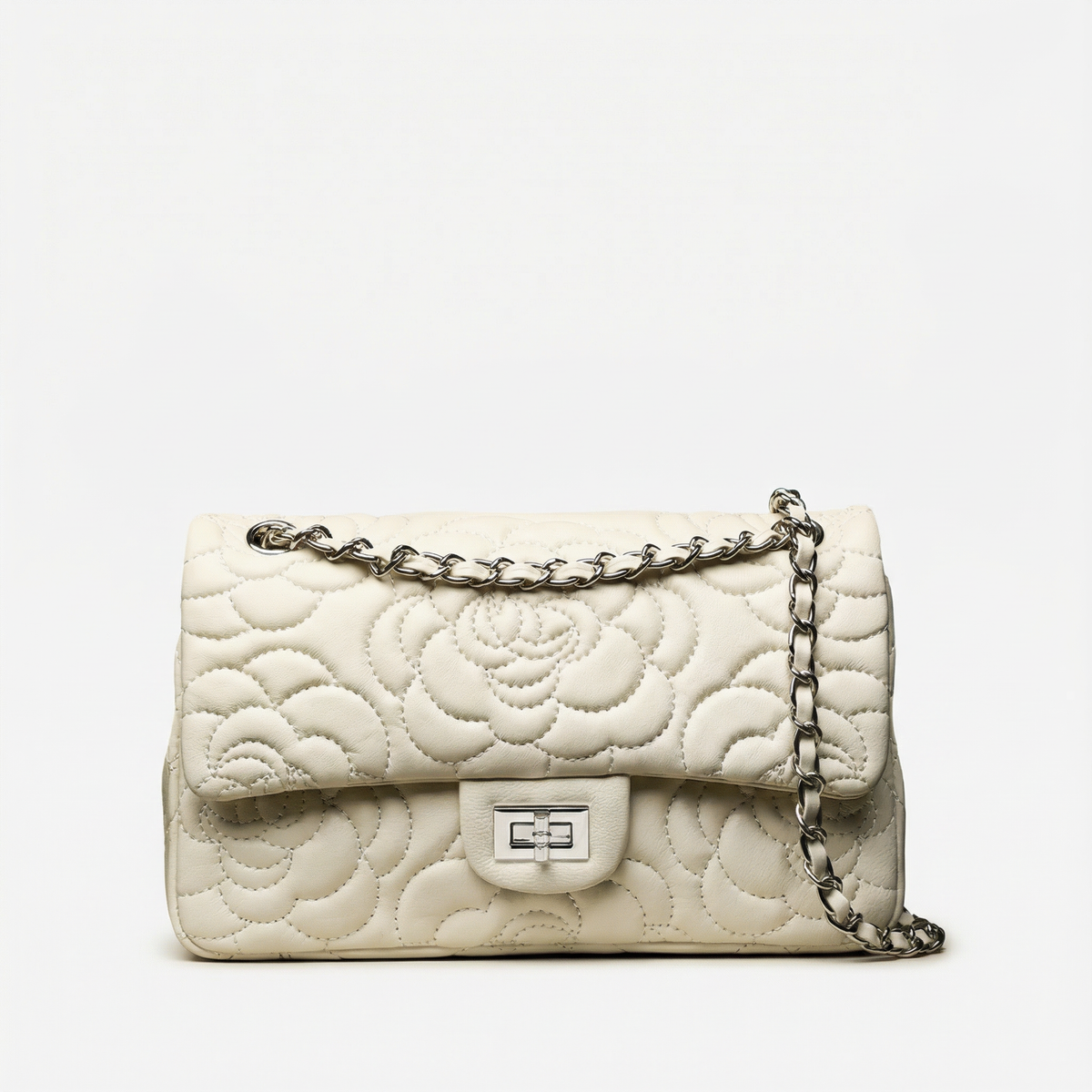 VAGOSHOPS Chiara quilted cream leather bag with floral stitching, silver chain strap, and polished metal hardware.