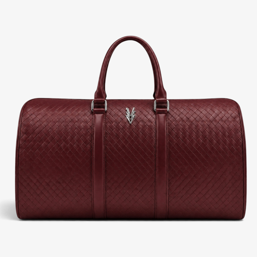 VAGOSHOPS Rocco weekend duffle in deep cranberry embossed woven-texture leather with silver-tone hardware.