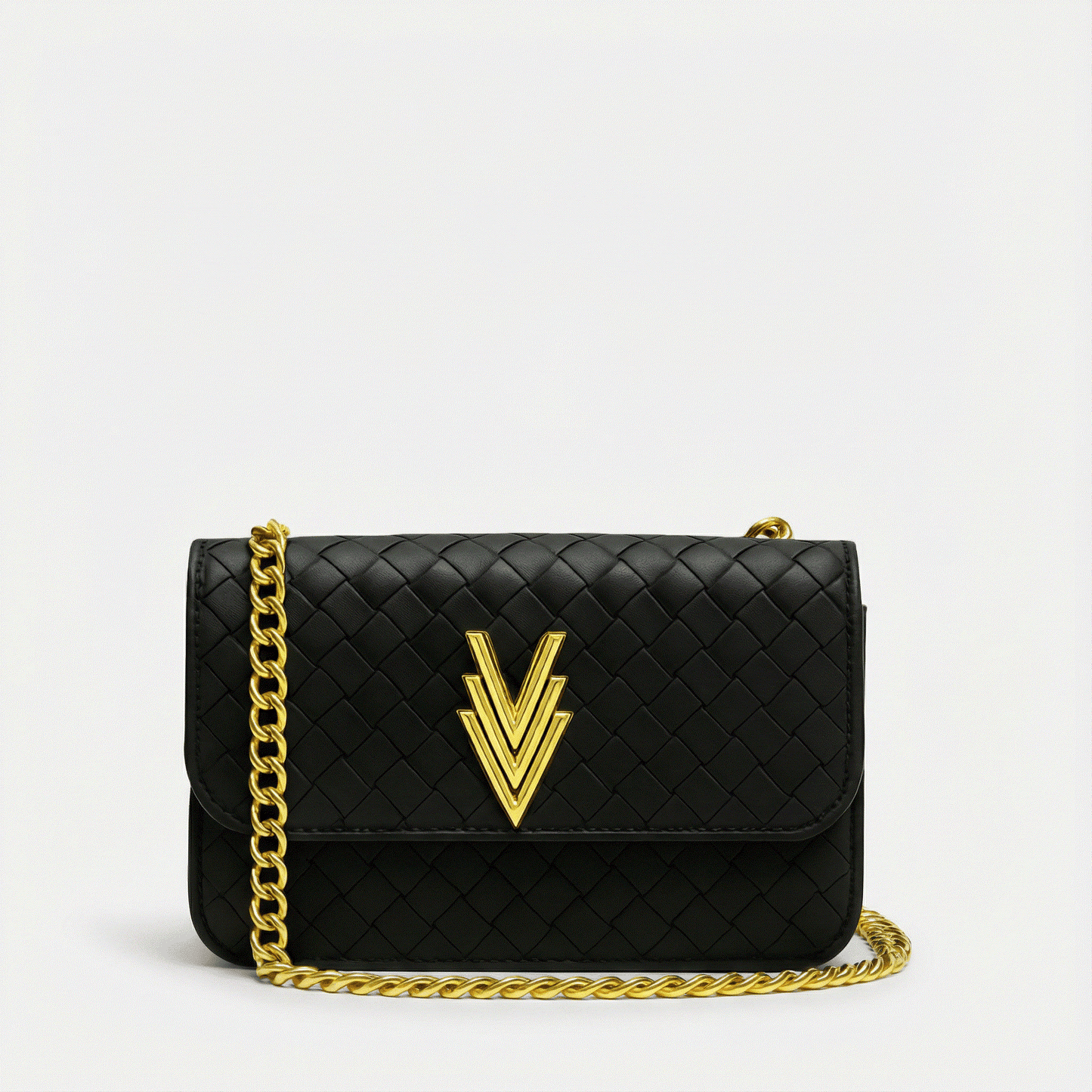 Black quilted handbag with gold chain and logo on a light gray background