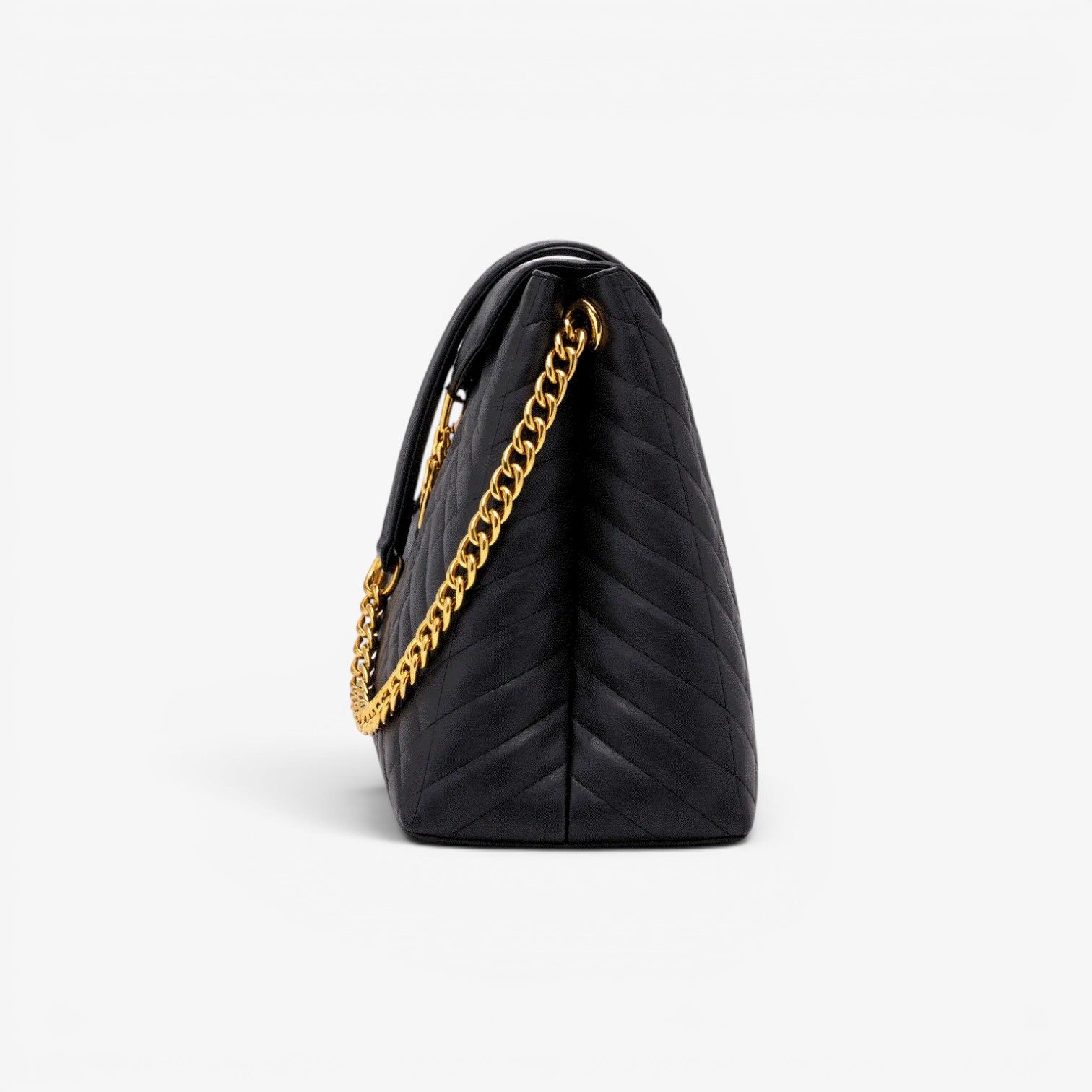 Black quilted handbag with a gold chain on a light gray background