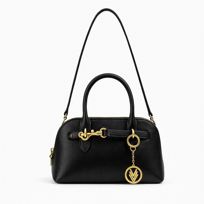 Black handbag with gold accents on a white background