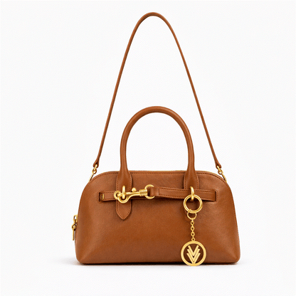 Brown handbag with gold accents on a white background