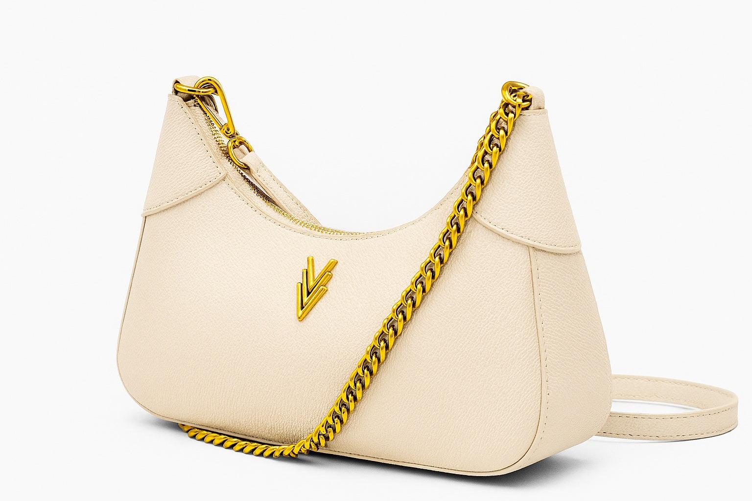 Beige handbag with a gold chain strap on a white background