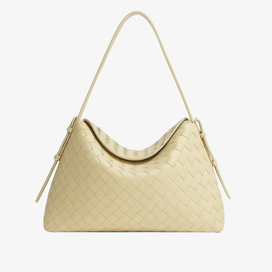 Beige woven handbag on a light gray background
