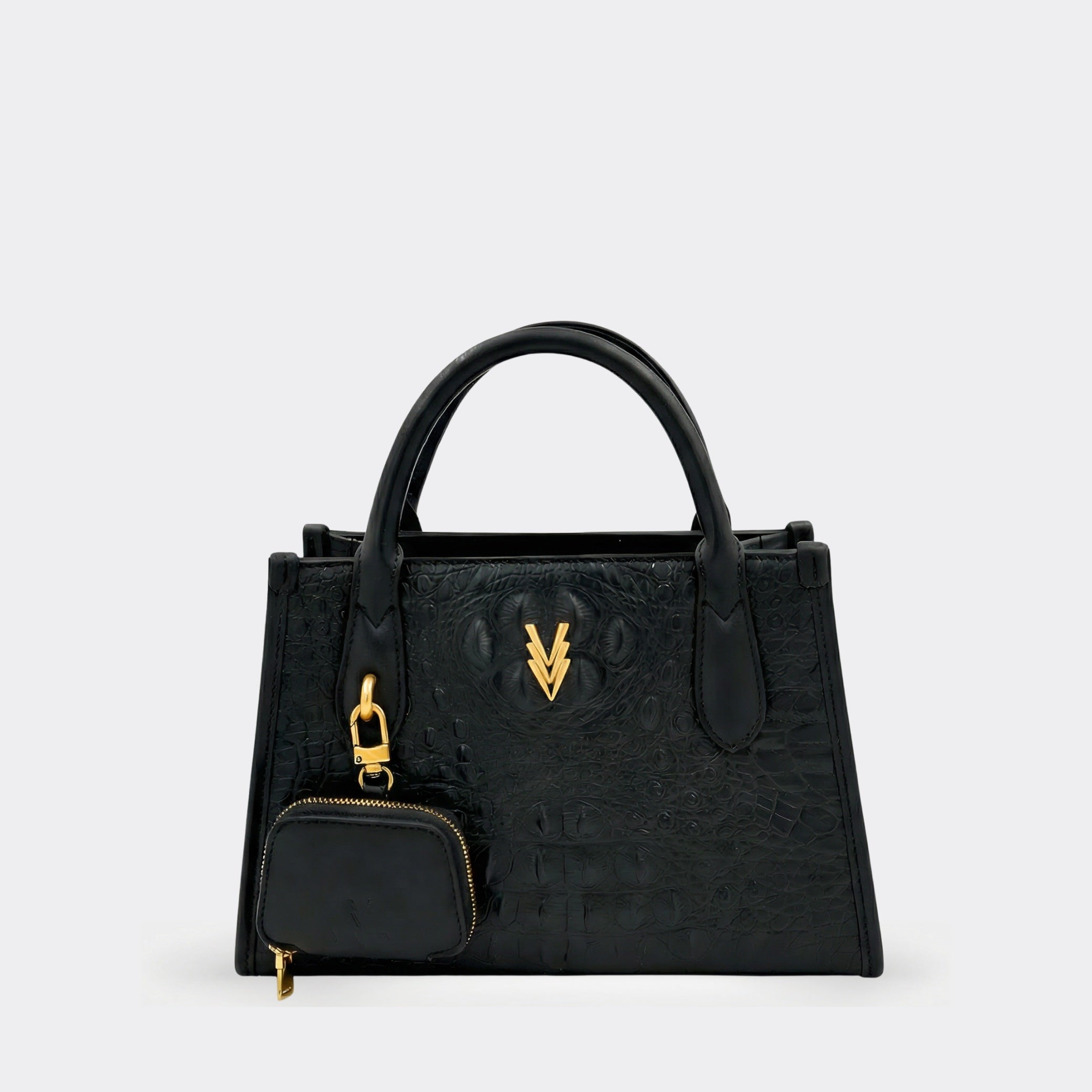 Black handbag with gold accents on a light gray background