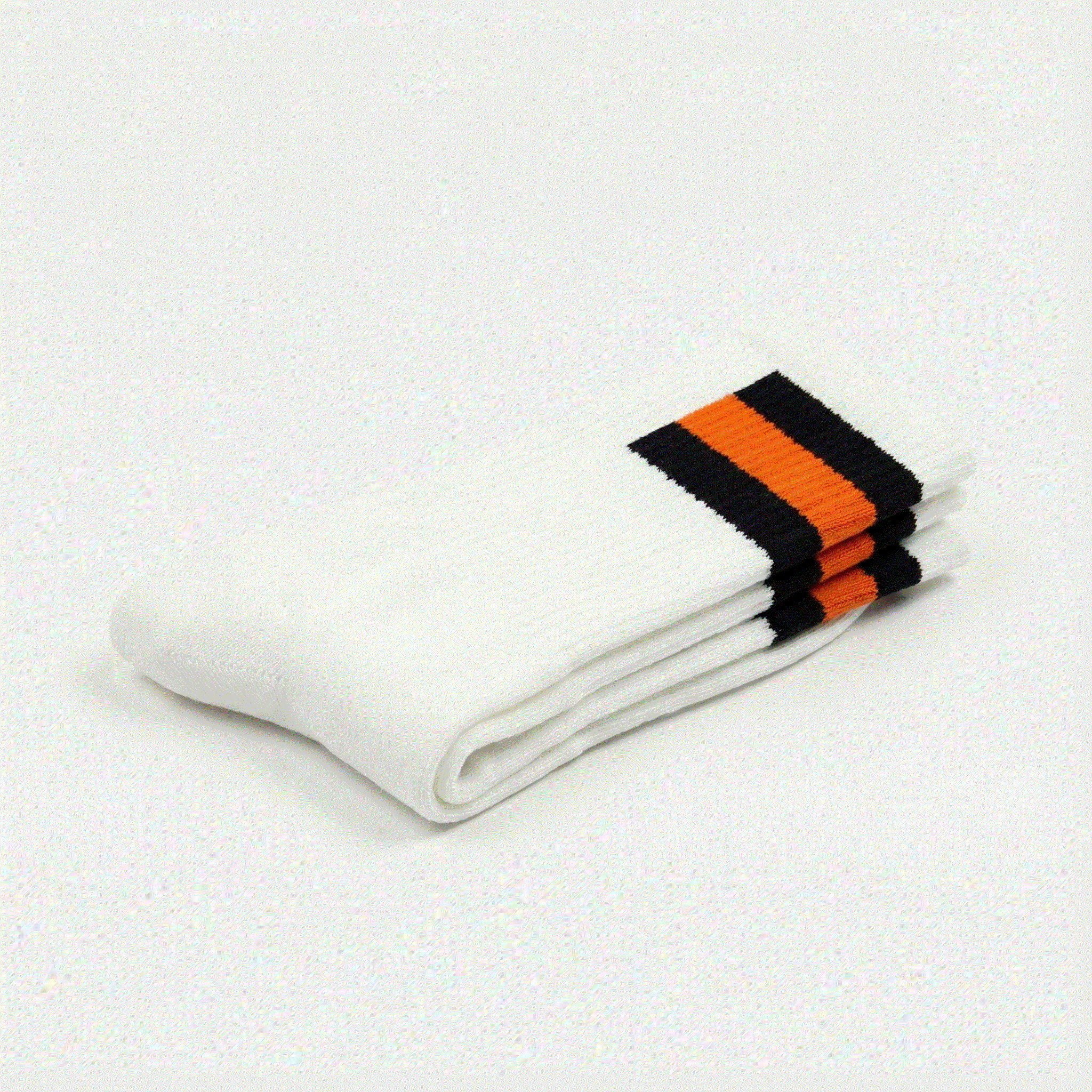 White socks with black and orange stripes on a white background