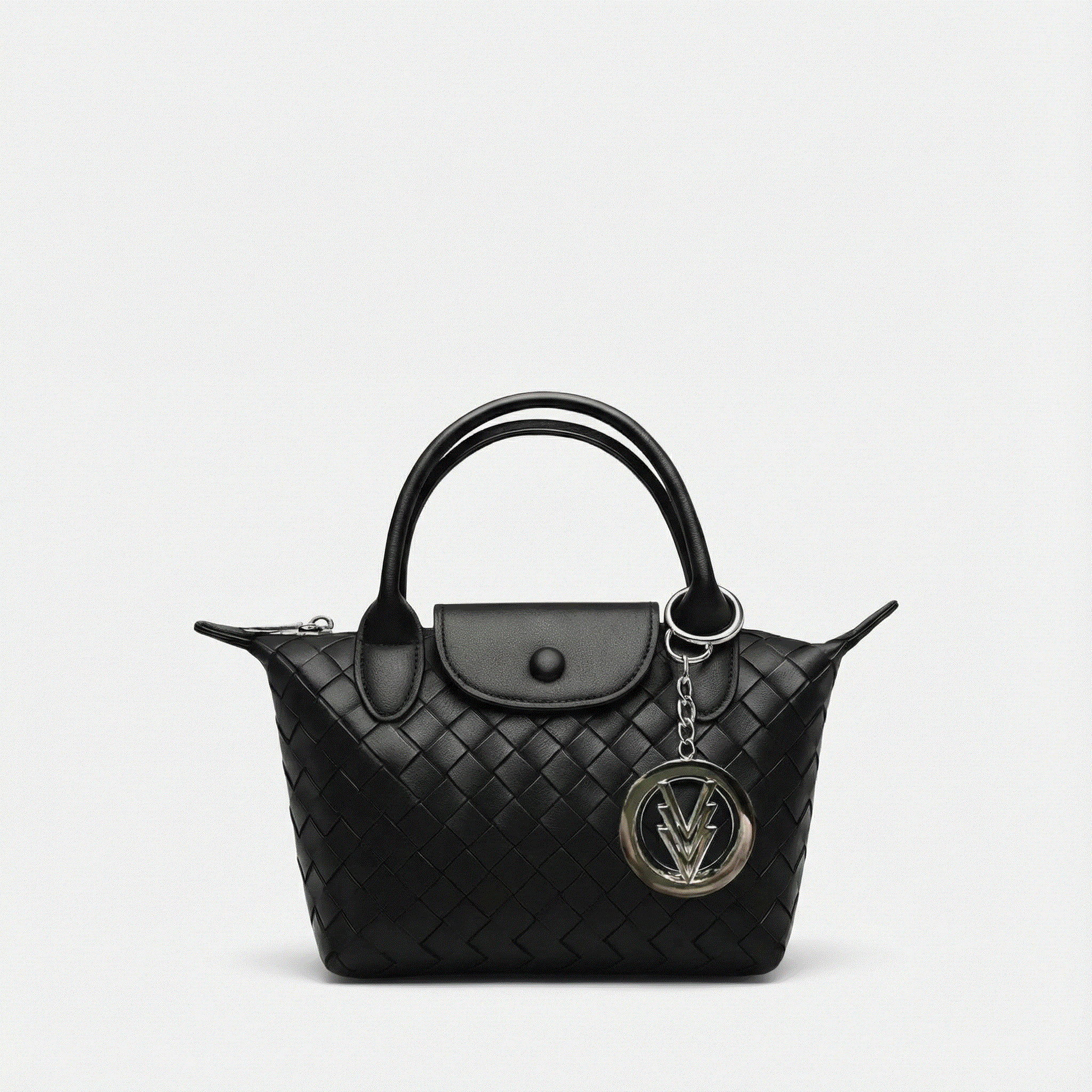 Black quilted handbag with a chain detail on a light gray background