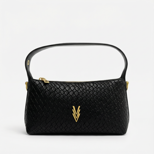 Black woven handbag with gold accents on a light gray background