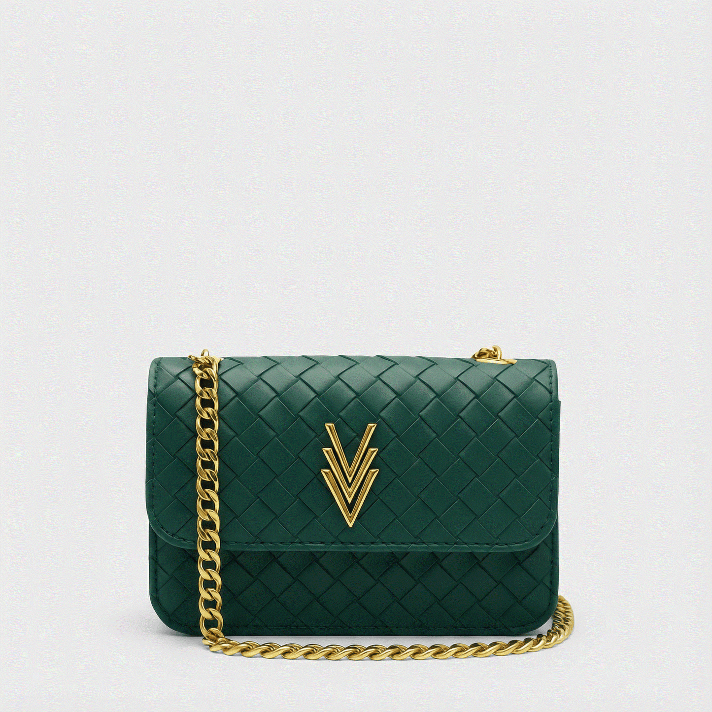 Green handbag with gold chain and logo on a light gray background