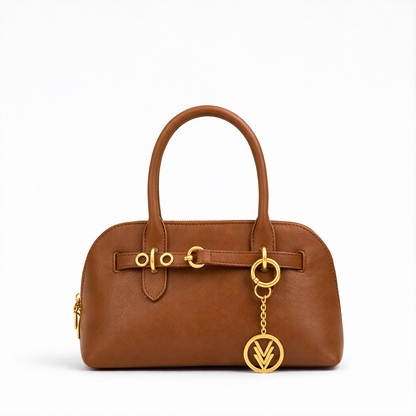 Brown handbag with gold accents on a white background