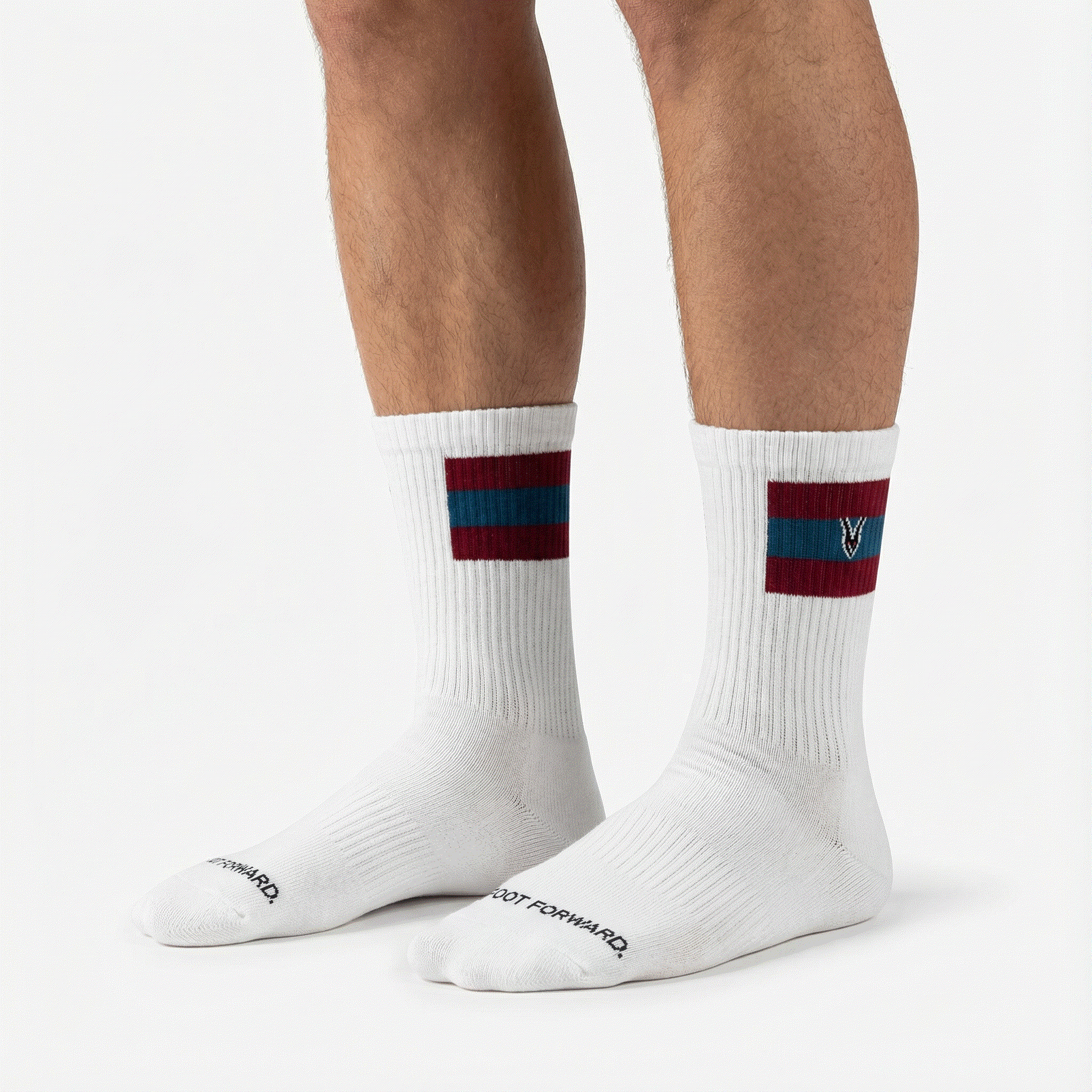 White socks with red and blue stripes worn by a person on a white background