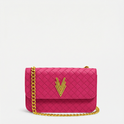 Pink handbag with gold chain and logo on a light gray background