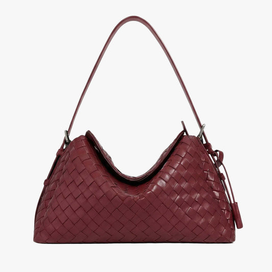 Maroon woven handbag on a light gray background