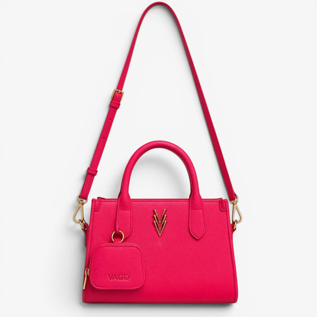 Pink handbag with gold accents on a white background
