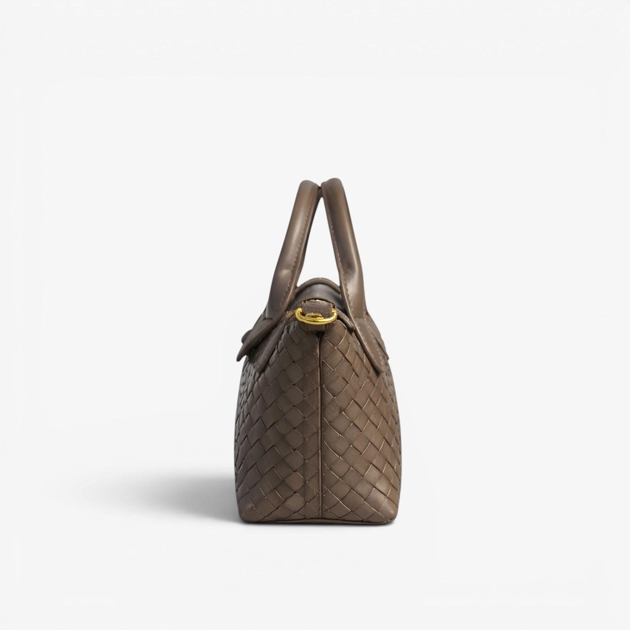 Brown woven handbag with a gold clasp on a white background