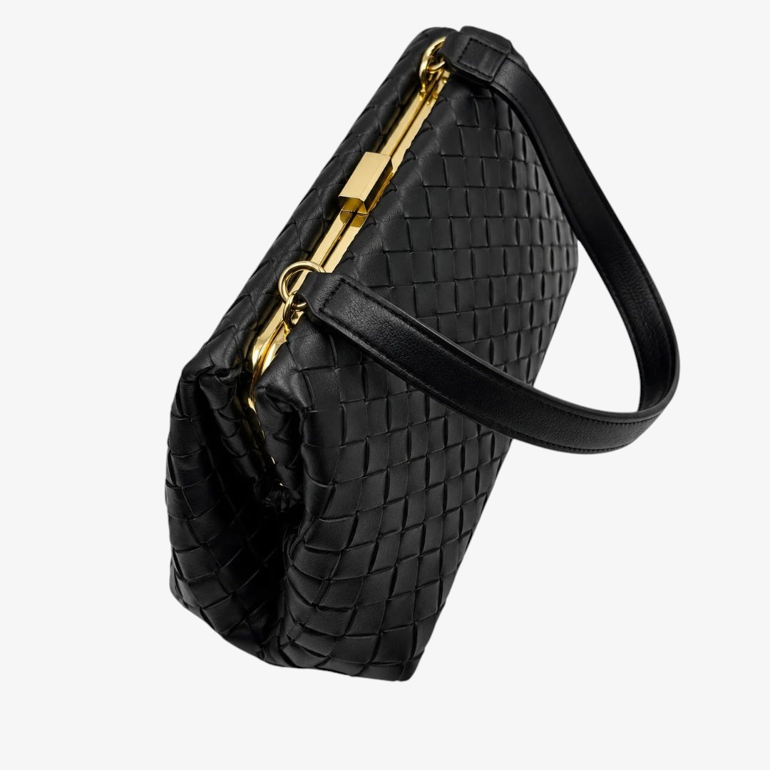 A black woven leather handbag with a structured rectangular shape, a single shoulder strap, and gold-tone hardware, shown on a plain white background.
