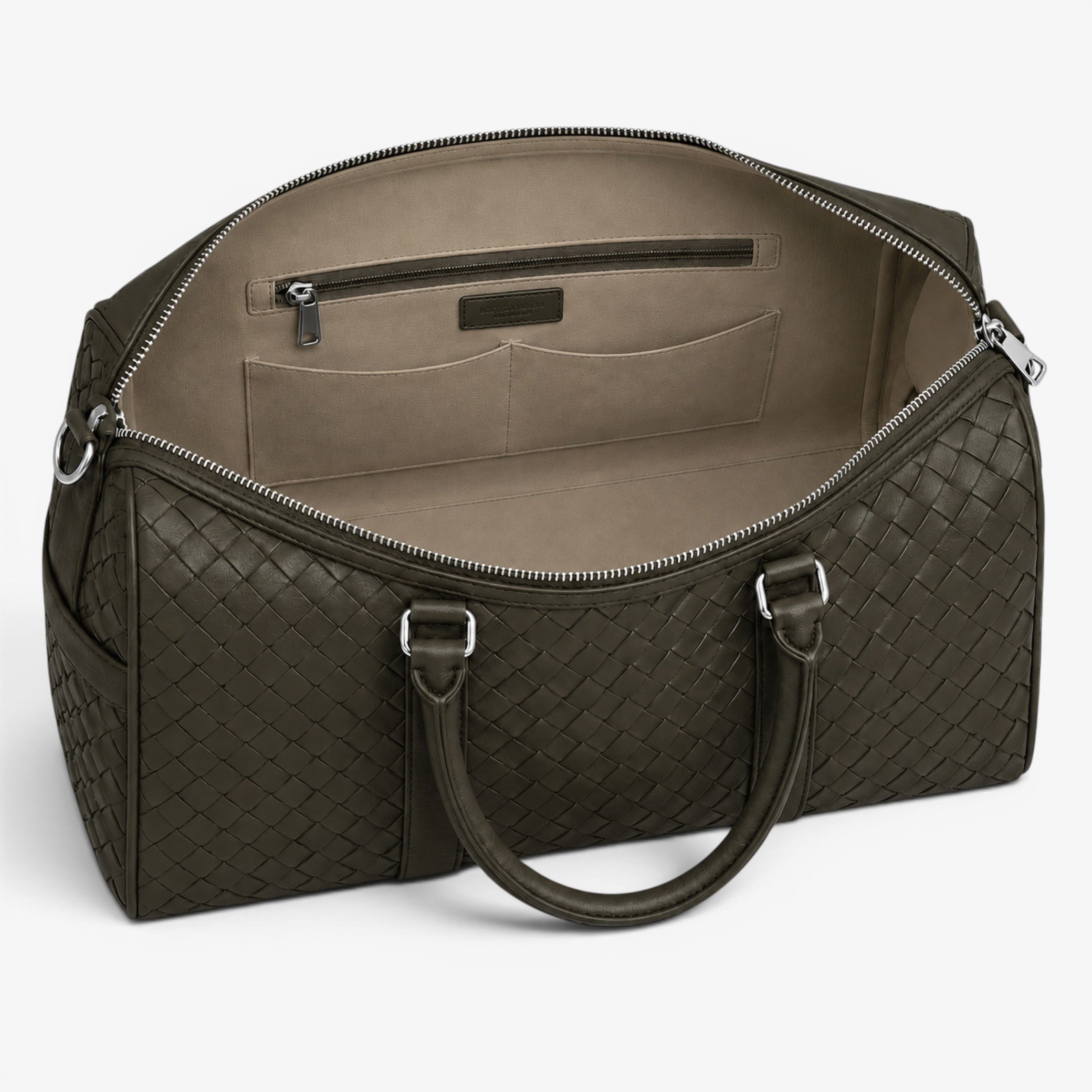 Green quilted duffel bag with open top on a white background