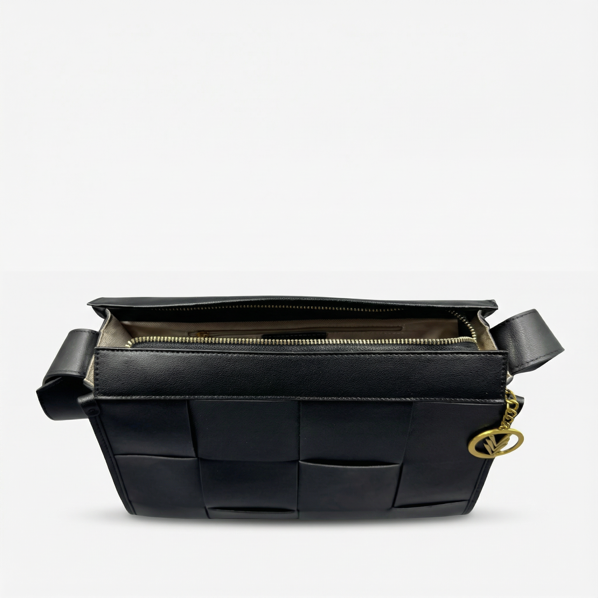 Black woven handbag with gold chain on a light gray background