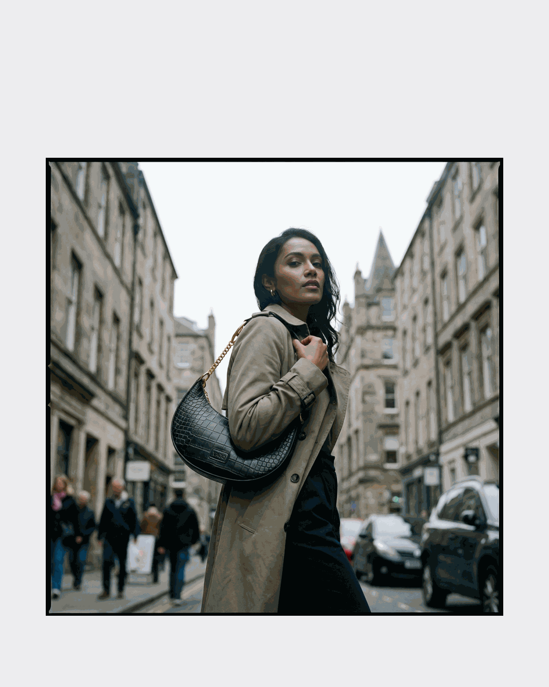 Model wearing black purse
