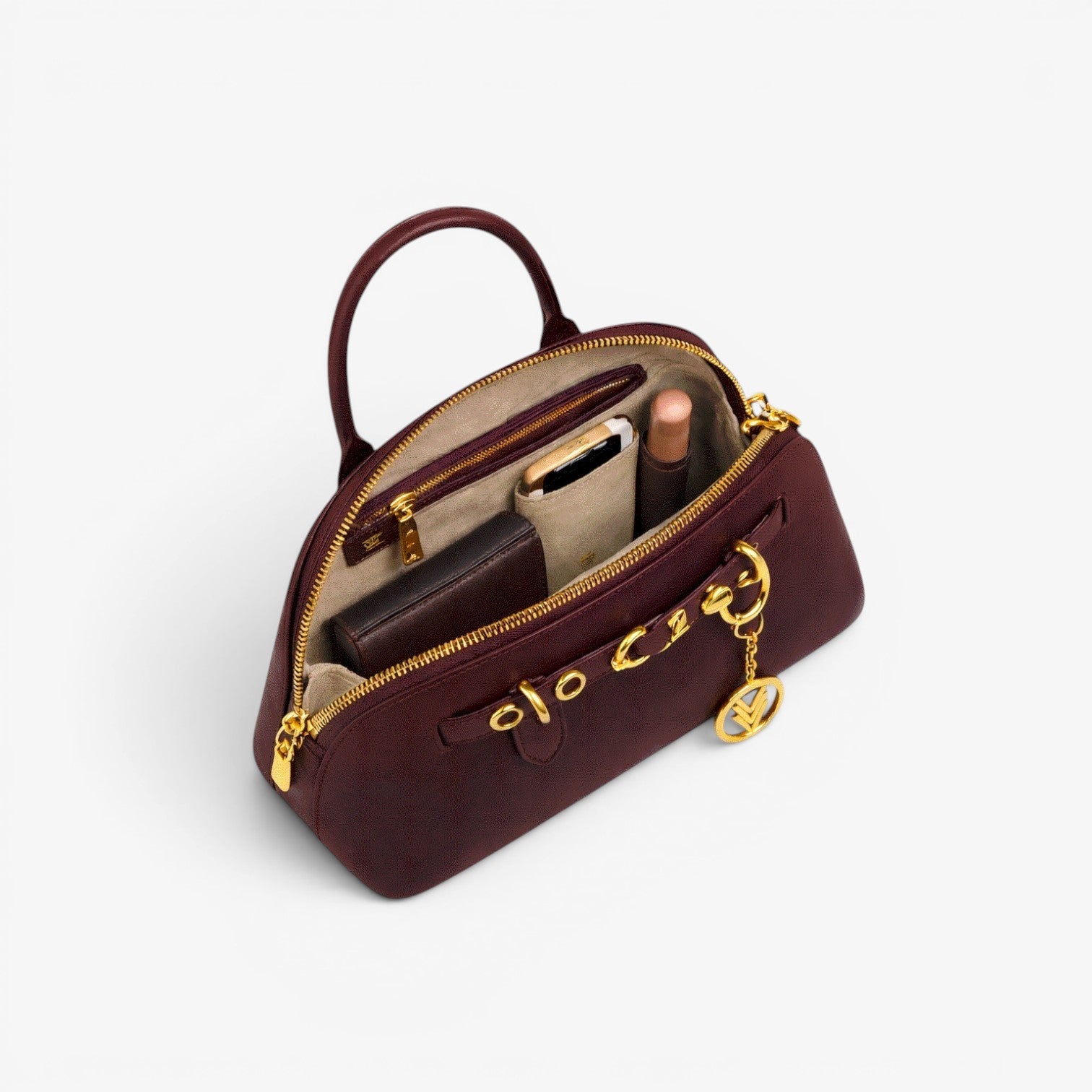 handbag with gold accents on a white background