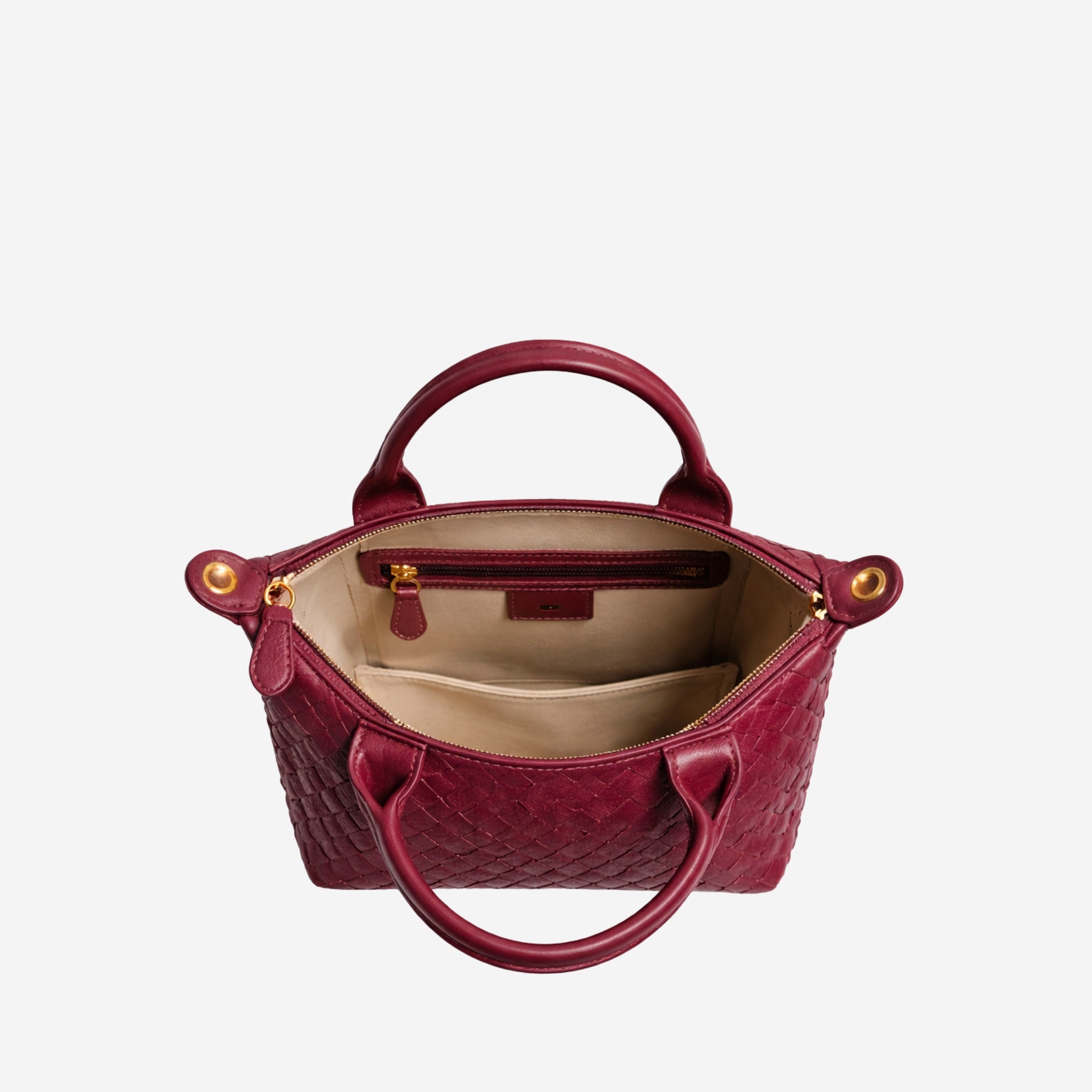 Red handbag with gold accents on a white background
