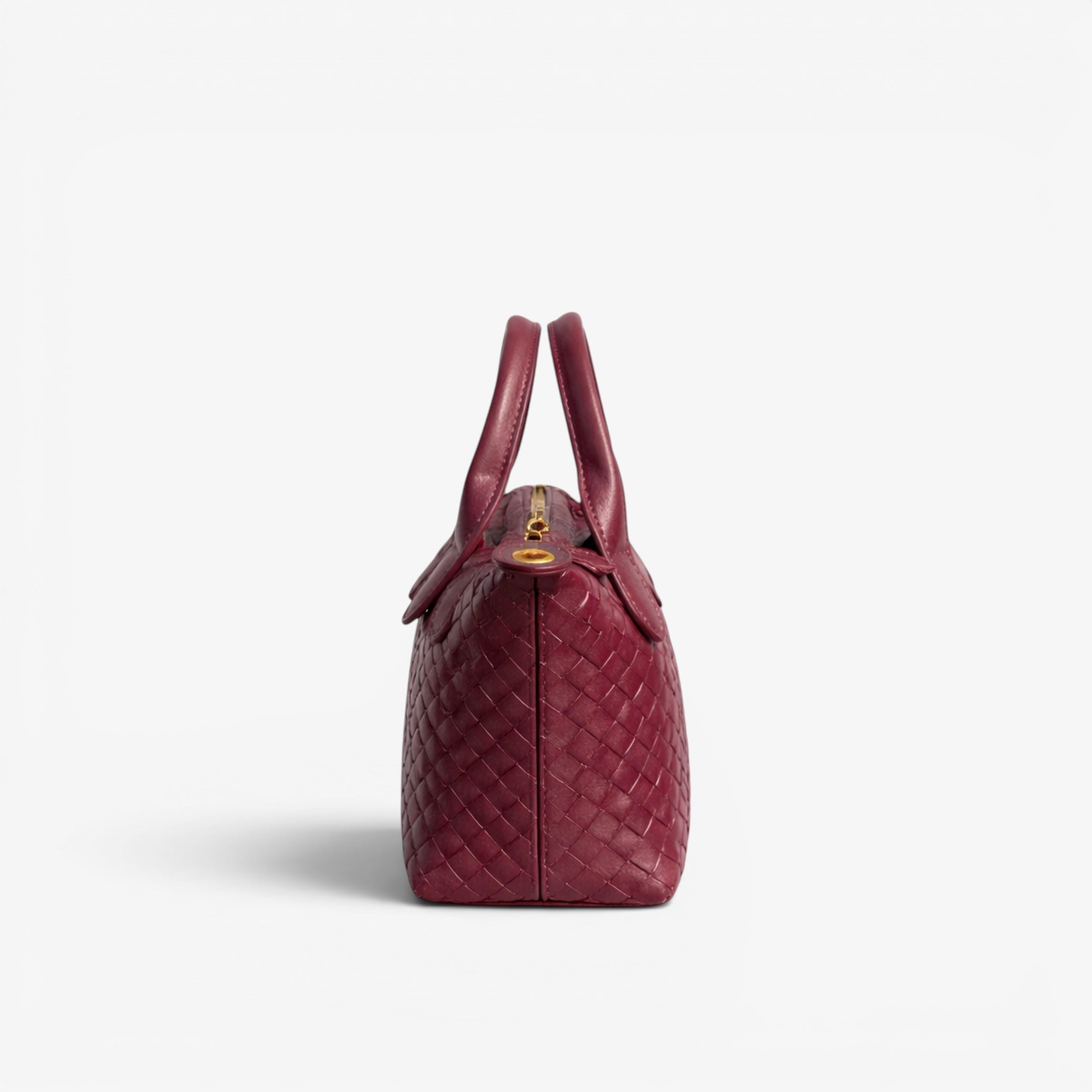 Red woven handbag on a white background
