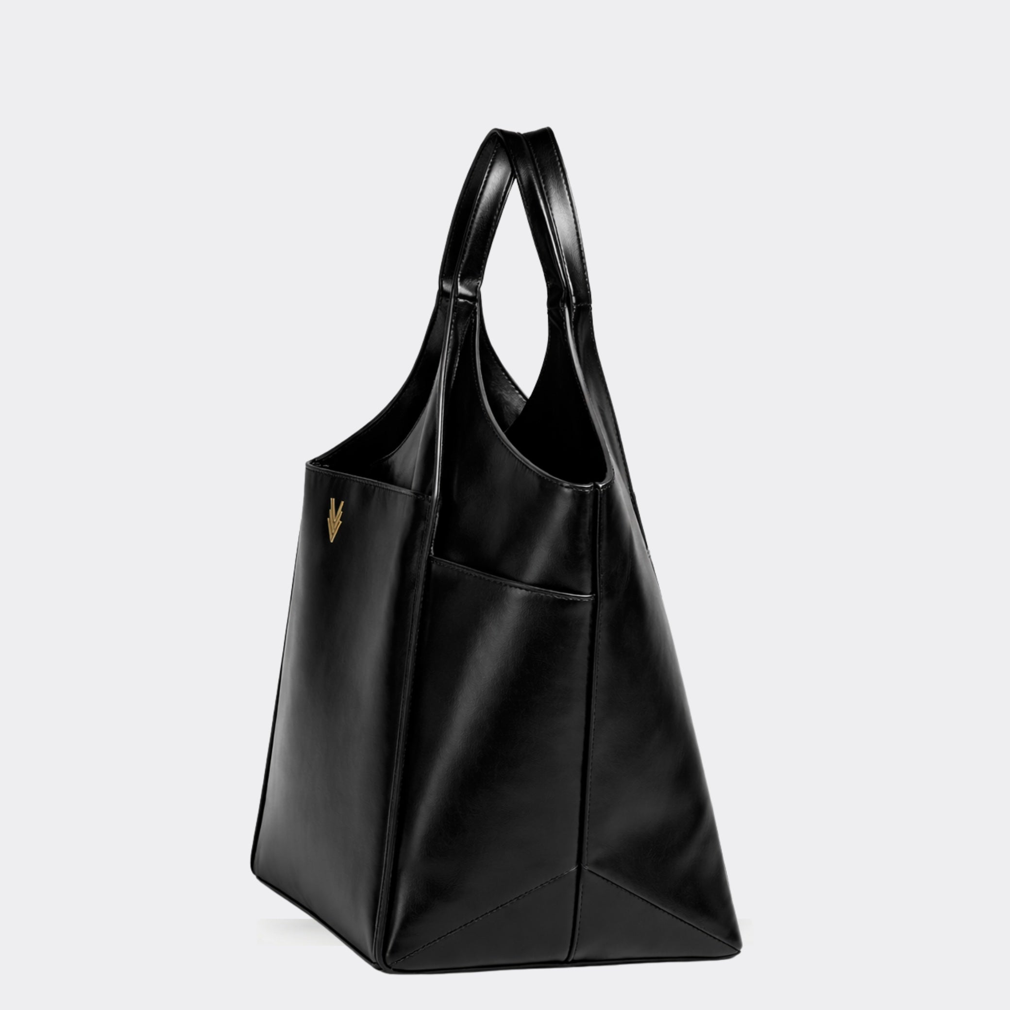 Black leather handbag on a light gray background