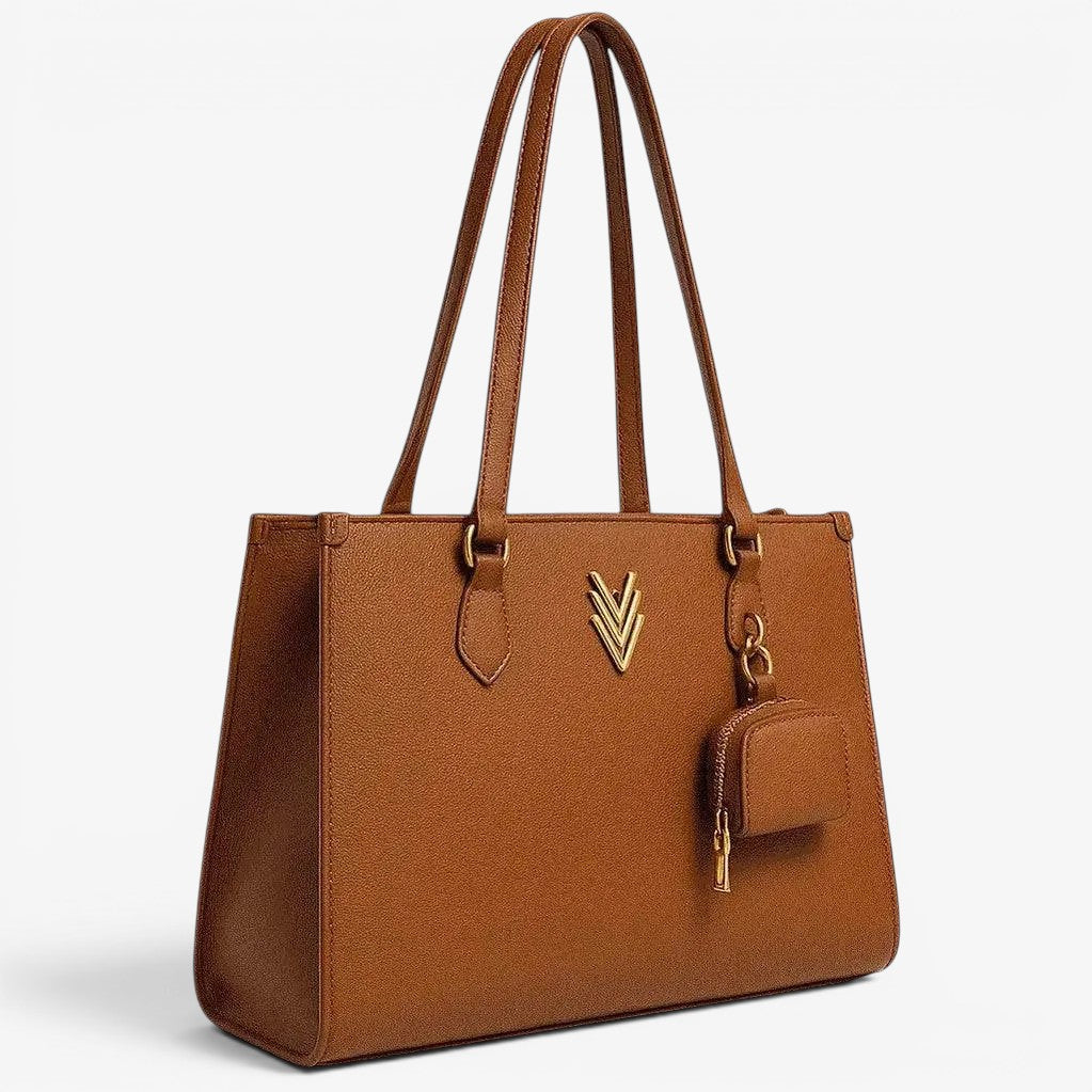 VAGOSHOPS Marilynn tote bag in rich brown textured vegan leather with gold-tone hardware and signature V emblem, includes matching headphone case.